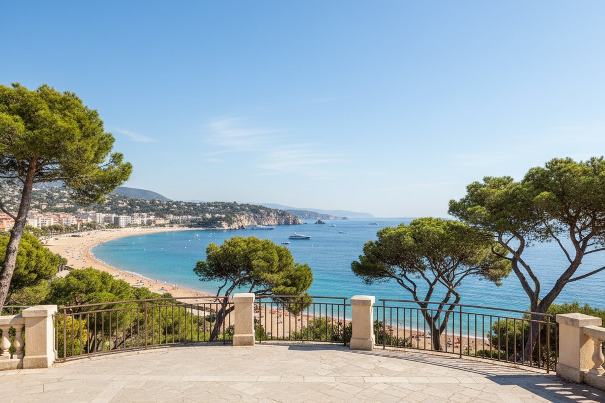 Sea-view terrace above the pines and sandy beach of Juan-les-Pins, Antibes, on the Cote d'Azur; illustrative, not a photograph of the listed property